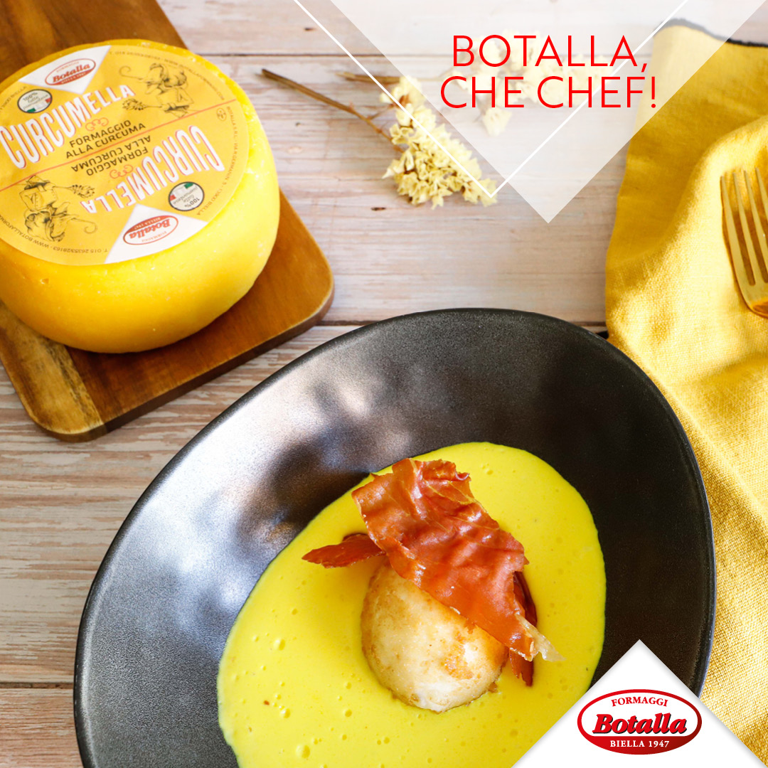 Uovo fritto con crema di formaggio alla curcuma e speck